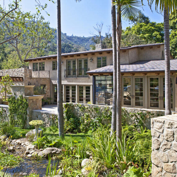 Custom Residence in Bel Air California featuring natural stone veneer with a landscaped spring by Hayne Architects.