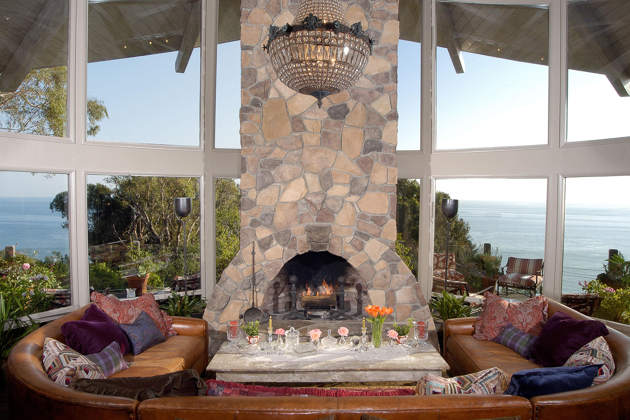 Interioor Living Room with natural stone fireplace an ocean view.