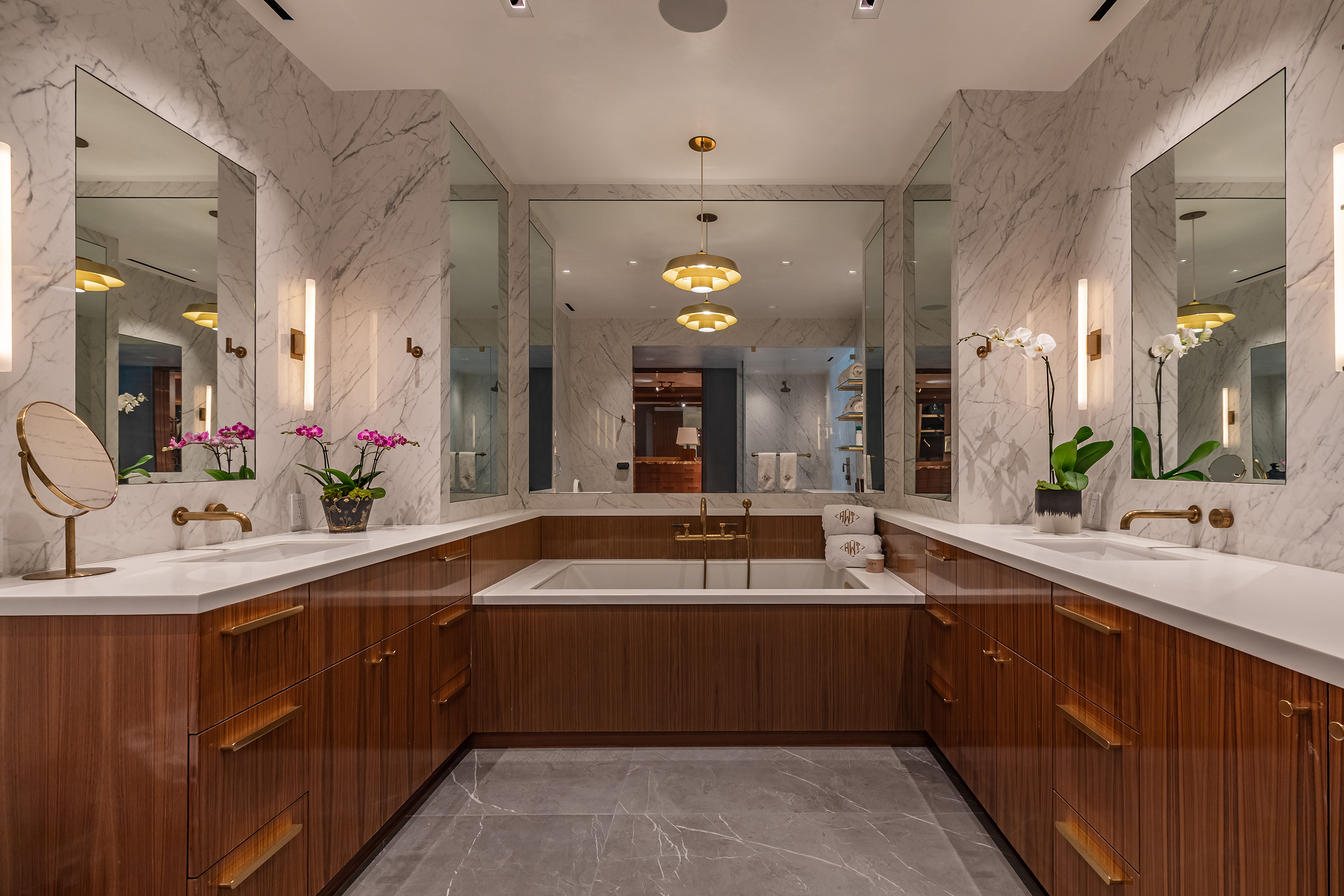 Primary Bathroom in West Hollywood apartment by Hayne Architects featuring venetian plaster ceiling, large format porcelain walls and lacquered walnut cabinetry.