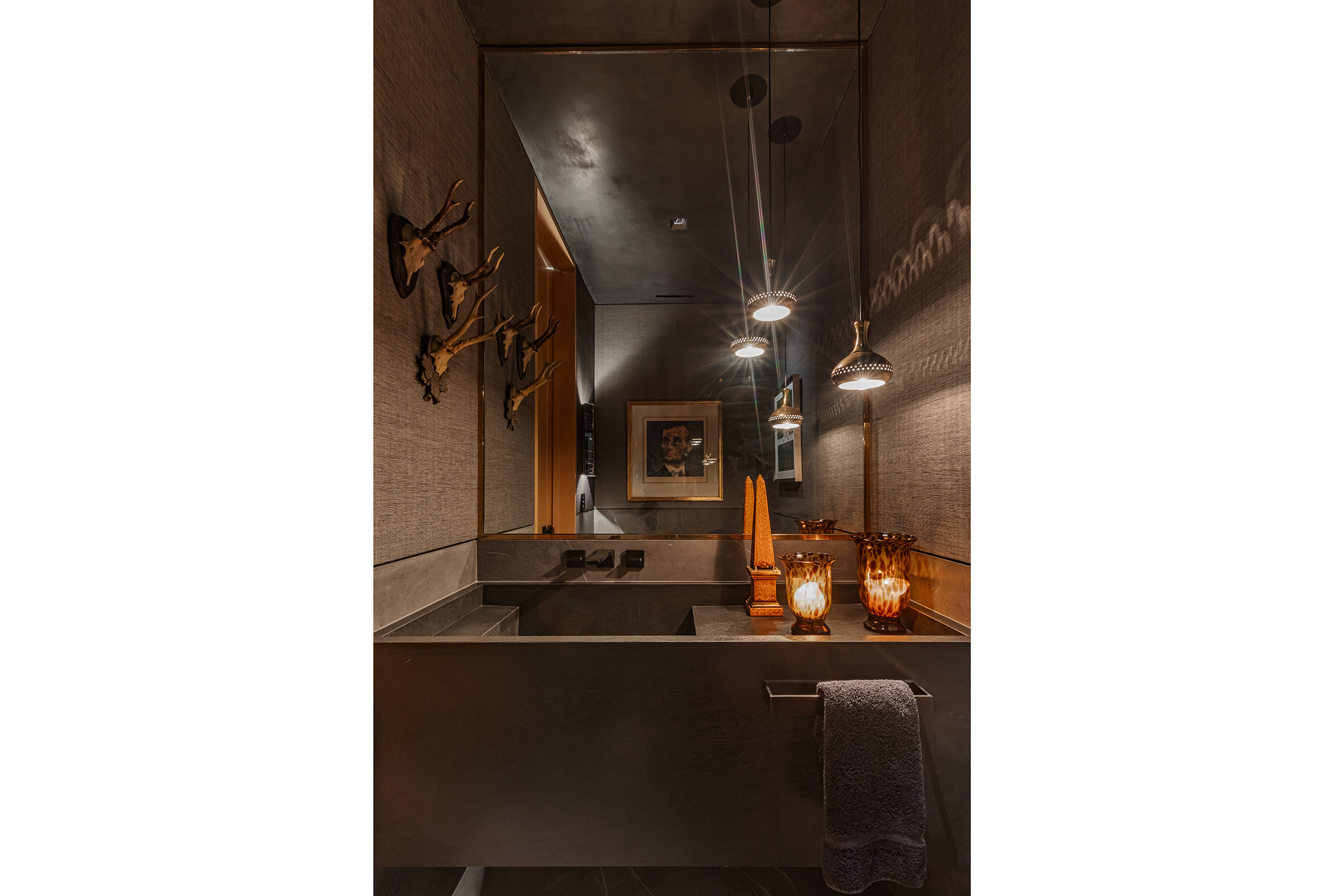 Powder Room in West Hollywood apartment by Hayne Architects featuring custom Laminam Porcelain sink and countertop with wall-mount faucet.