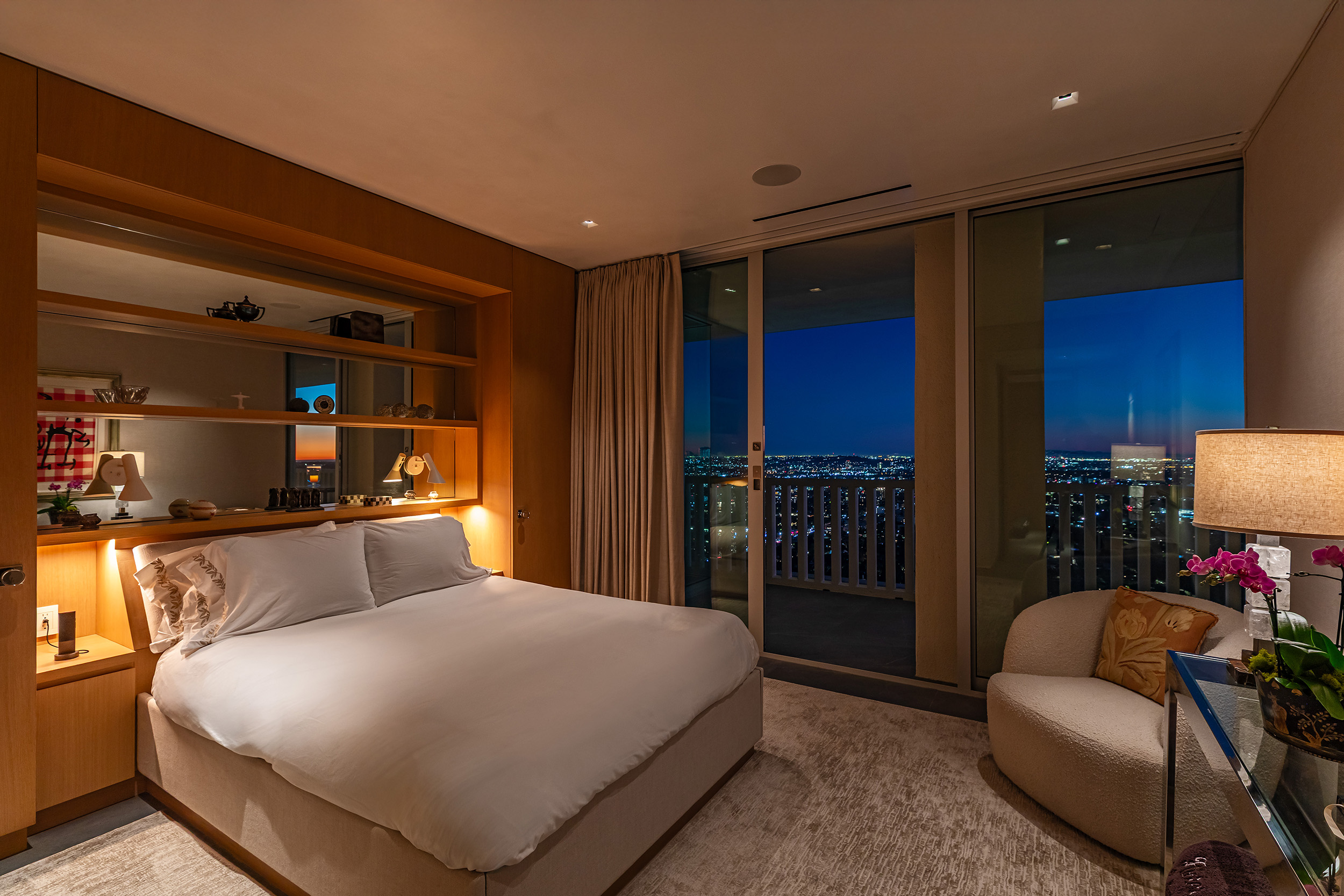 Bedroom in West Hollywood apartment by Hayne Architects featuring venetian plaster ceiling, large format tile and wood built-in storage with bed.